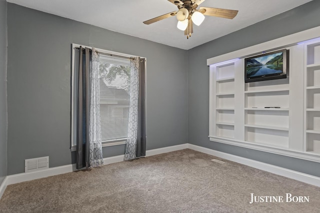 2264 Stafford Ave SW, Grand Rapids, MI 49507 - carpeted empty room featuring a ceiling fan and baseboards