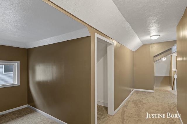 2264 Stafford Ave SW, Grand Rapids, MI 49507 - corridor featuring a textured ceiling, carpet floors, and baseboards
