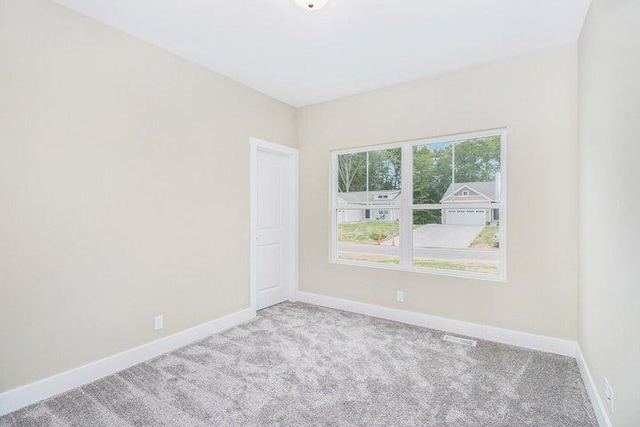 6218 Sturgeon Run, Muskegon, MI 49444 - unfurnished room featuring carpet flooring and baseboards