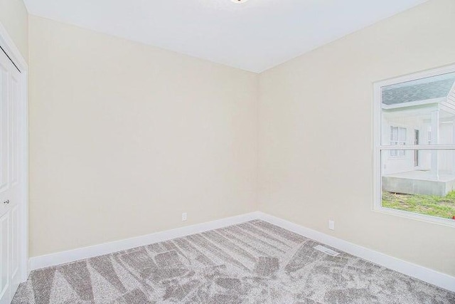 6218 Sturgeon Run, Muskegon, MI 49444 - unfurnished room with carpet flooring and baseboards