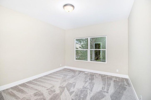 6218 Sturgeon Run, Muskegon, MI 49444 - carpeted empty room featuring baseboards