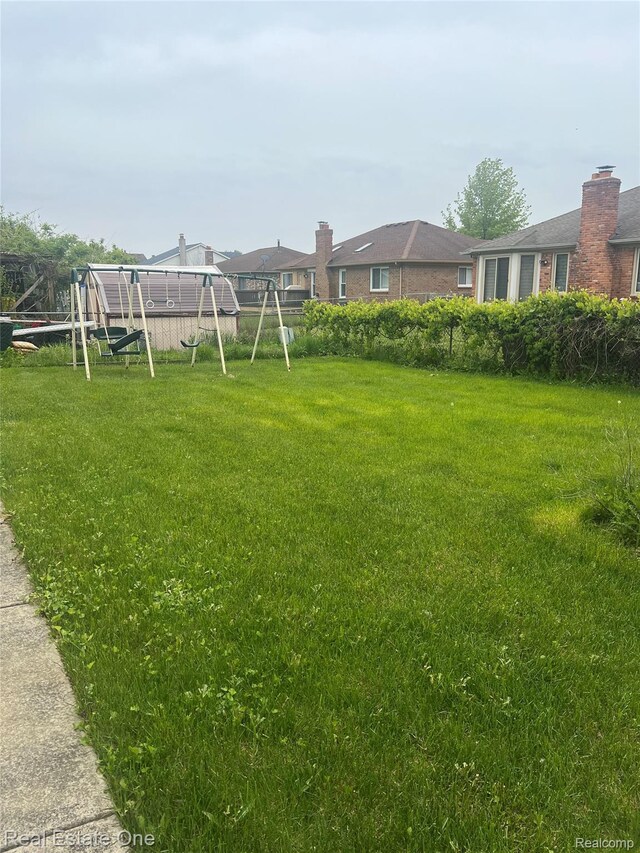 35715 Maureen Dr, Sterling Heights, MI 48310 - view of yard featuring a playground