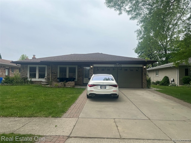 35715 Maureen Dr, Sterling Heights, MI 48310 - view of front of home featuring concrete driveway, an attached garage, a front yard, and brick siding