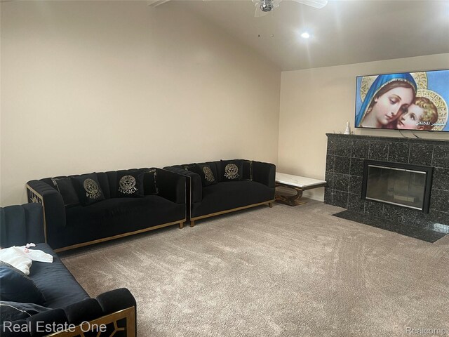 35715 Maureen Dr, Sterling Heights, MI 48310 - living area featuring carpet flooring, vaulted ceiling, ceiling fan, and a tile fireplace