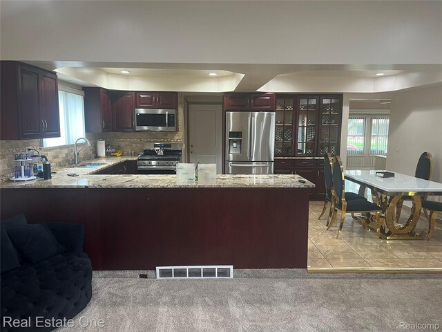 35715 Maureen Dr, Sterling Heights, MI 48310 - kitchen with stainless steel appliances, a sink, a raised ceiling, decorative backsplash, and recessed lighting