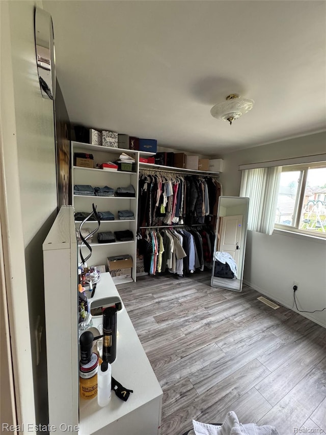 35715 Maureen Dr, Sterling Heights, MI 48310 - walk in closet with wood finished floors