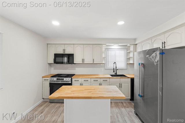 14920 Myola Ave, Warren, MI 48089 - kitchen featuring butcher block counters, stainless steel appliances, backsplash, light wood finished floors, and recessed lighting