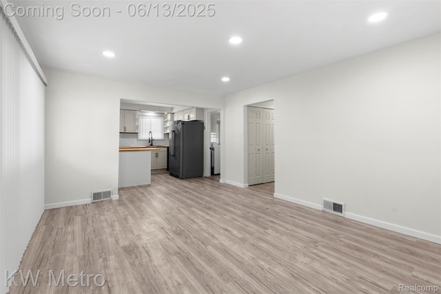 14920 Myola Ave, Warren, MI 48089 - unfurnished living room with light wood-style floors and recessed lighting