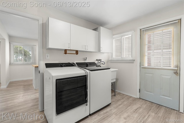 14920 Myola Ave, Warren, MI 48089 - laundry room featuring cabinet space, washer and dryer, and light wood finished floors