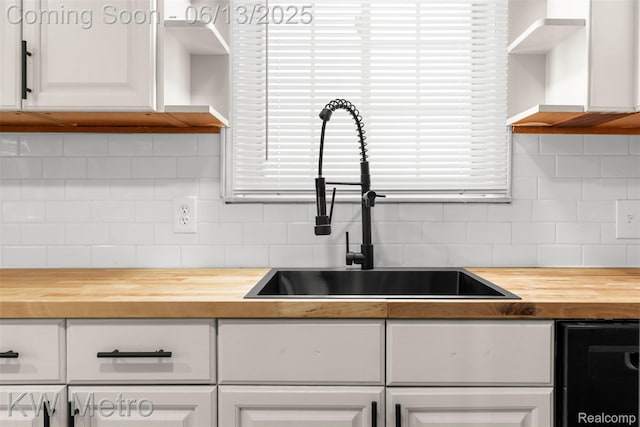 14920 Myola Ave, Warren, MI 48089 - kitchen with wood counters, open shelves, white cabinetry, and decorative backsplash