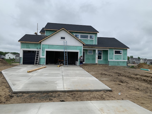 15765 Norwalk Rd, Grand Haven, MI 49417 - property under construction with driveway, roof with shingles, and a garage