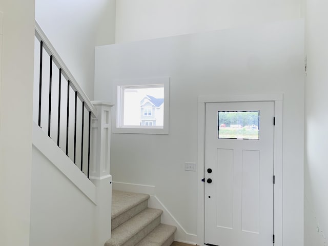 15765 Norwalk Rd, Grand Haven, MI 49417 - foyer entrance featuring stairway and a towering ceiling