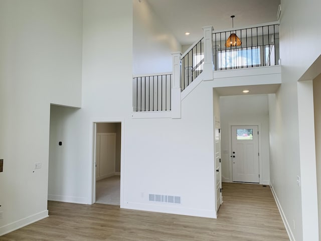 15765 Norwalk Rd, Grand Haven, MI 49417 - entrance foyer with a high ceiling and light wood finished floors