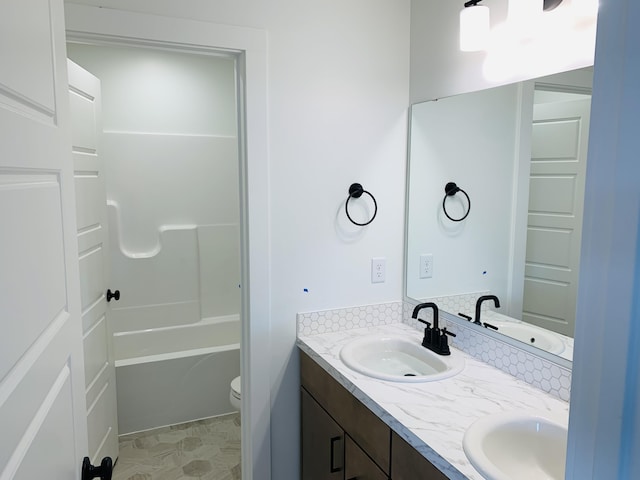 15765 Norwalk Rd, Grand Haven, MI 49417 - bathroom featuring double vanity and shower / bathtub combination