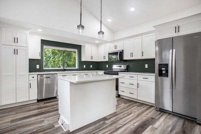 103 W Pearl St, Marshall, MI 49068 - kitchen featuring stainless steel appliances, light countertops, wood finished floors, decorative backsplash, and recessed lighting