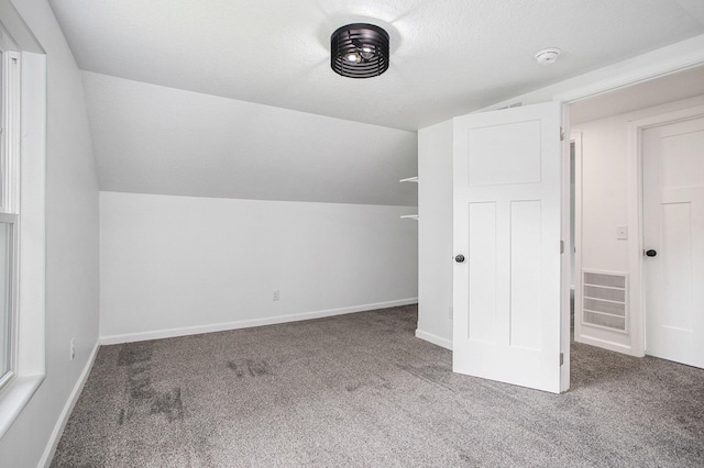 103 W Pearl St, Marshall, MI 49068 - additional living space featuring carpet floors, lofted ceiling, and baseboards