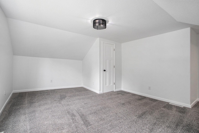 103 W Pearl St, Marshall, MI 49068 - bonus room featuring vaulted ceiling, carpet flooring, and baseboards