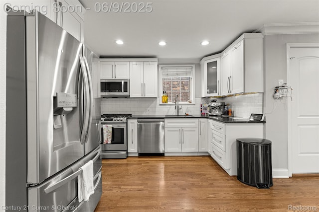 300 S Melborn St, Dearborn, MI 48124 - kitchen with appliances with stainless steel finishes, a sink, dark countertops, crown molding, and recessed lighting