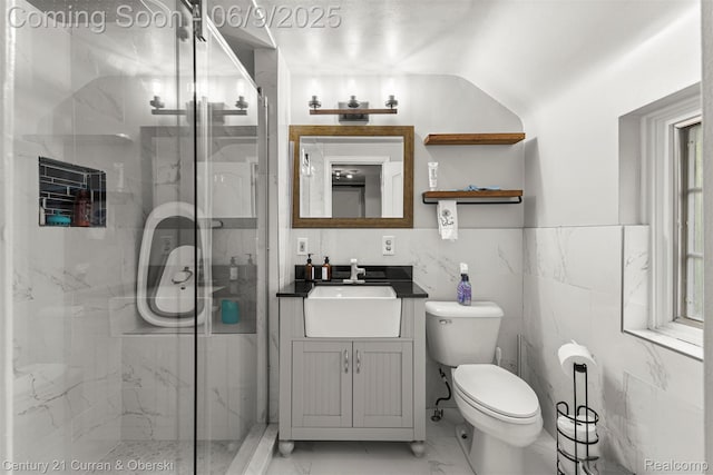 300 S Melborn St, Dearborn, MI 48124 - bathroom with vanity, marble finish floors, a marble finish shower, toilet, and tile walls