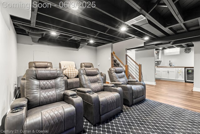 300 S Melborn St, Dearborn, MI 48124 - home theater featuring beverage cooler, bar with sink, and light wood-style floors