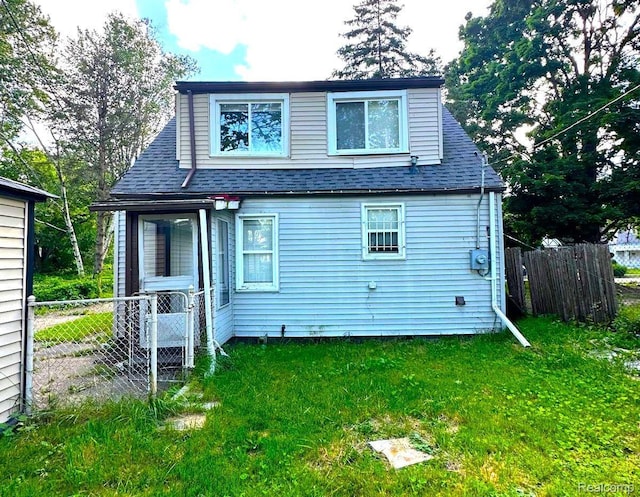4598 Lodewyck St, Detroit, MI 48224 - back of house featuring roof with shingles