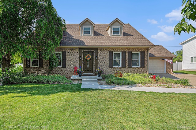 813 Birchwood Dr, Flushing, MI 48433 - cape cod house with brick siding, an attached garage, driveway, a front lawn, and roof with shingles
