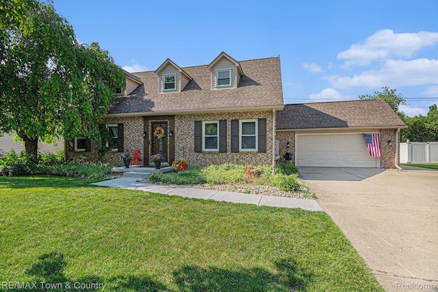 813 Birchwood Dr, Flushing, MI 48433 - cape cod home with an attached garage, brick siding, concrete driveway, and a shingled roof