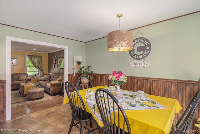 813 Birchwood Dr, Flushing, MI 48433 - dining room featuring ornamental molding, wainscoting, and wooden walls