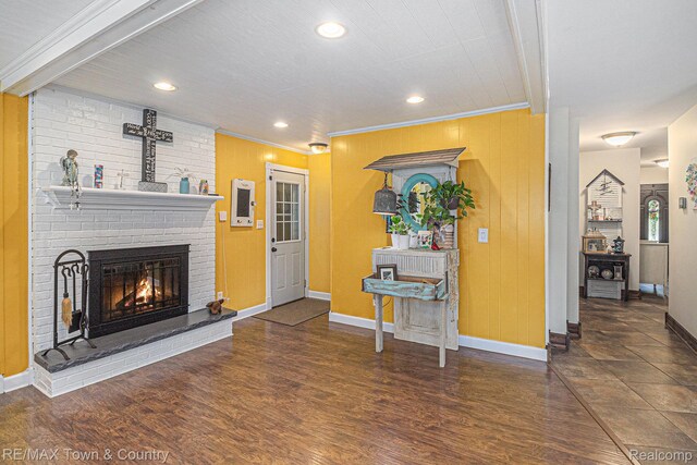 813 Birchwood Dr, Flushing, MI 48433 - living room featuring a brick fireplace, baseboards, ornamental molding, wood finished floors, and recessed lighting