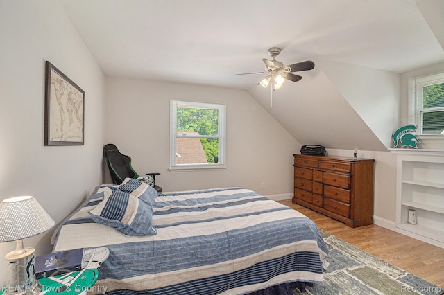 813 Birchwood Dr, Flushing, MI 48433 - bedroom featuring wood finished floors, a ceiling fan, baseboards, and lofted ceiling