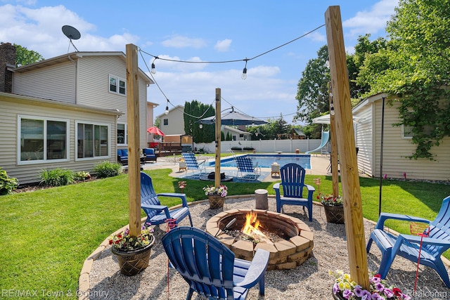 813 Birchwood Dr, Flushing, MI 48433 - view of patio featuring an outdoor fire pit and an outdoor structure