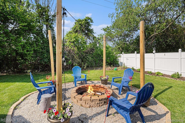 813 Birchwood Dr, Flushing, MI 48433 - view of patio featuring a fire pit