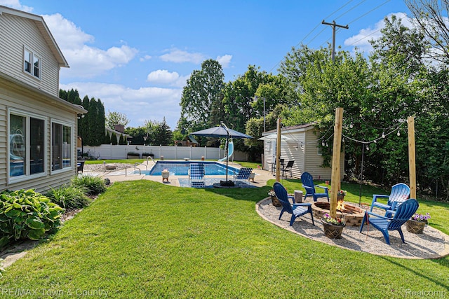 813 Birchwood Dr, Flushing, MI 48433 - view of yard featuring a fire pit, an outbuilding, and a patio area