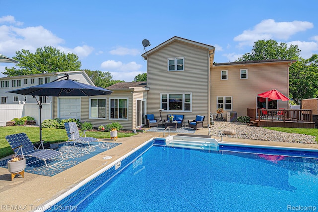 813 Birchwood Dr, Flushing, MI 48433 - view of swimming pool featuring an outdoor living space, a wooden deck, and a patio area