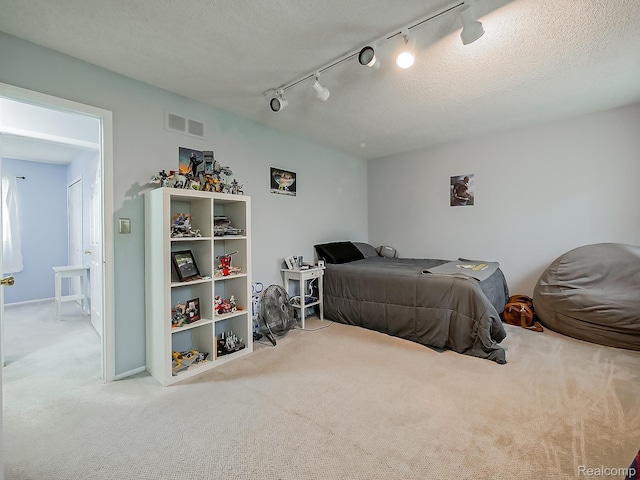 1725 Windingway Dr, Wixom, MI 48393 - carpeted bedroom with track lighting and baseboards