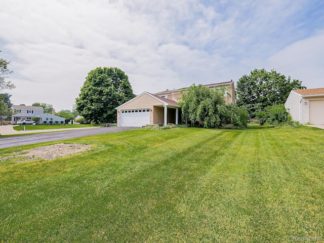 1725 Windingway Dr, Wixom, MI 48393 - view of front of property featuring a front lawn, driveway, and an attached garage
