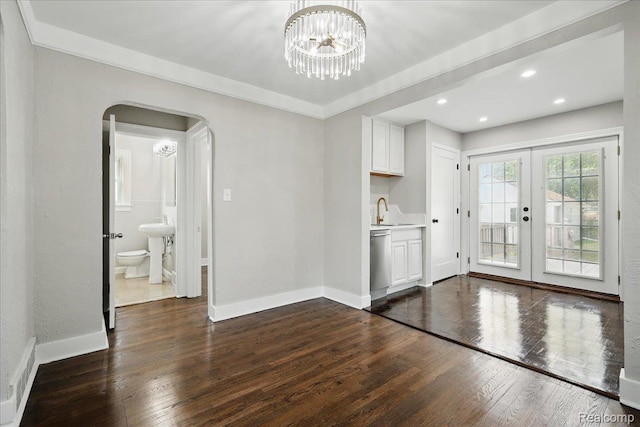 3345 Curwood St, Bloomfield Hills, MI 48329 - unfurnished dining area with french doors, arched walkways, dark wood-style flooring, a sink, and recessed lighting
