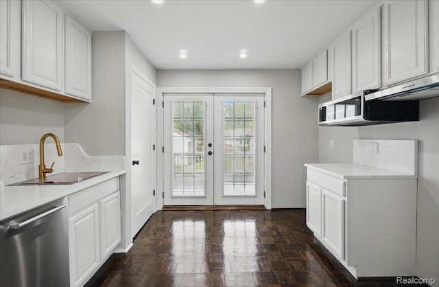 3345 Curwood St, Bloomfield Hills, MI 48329 - kitchen with stainless steel dishwasher, a sink, french doors, white cabinetry, and recessed lighting