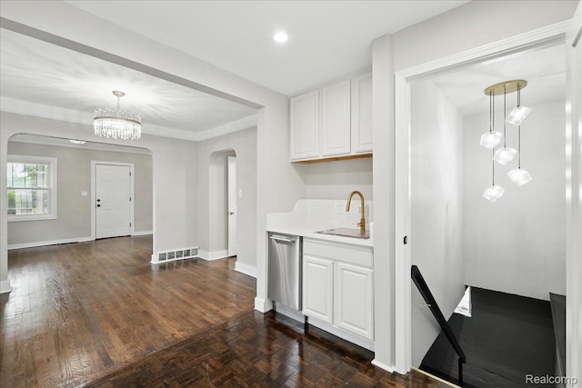 3345 Curwood St, Bloomfield Hills, MI 48329 - kitchen featuring a sink, arched walkways, dishwasher, and white cabinets
