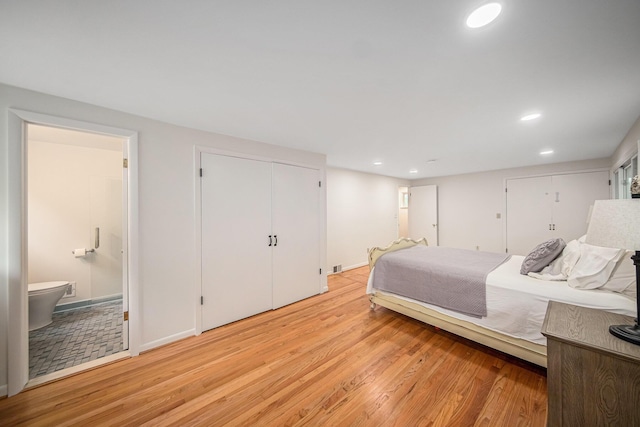 2402 Victoria Ave, Ann Arbor, MI 48104 - bedroom featuring light wood finished floors, recessed lighting, and ensuite bath