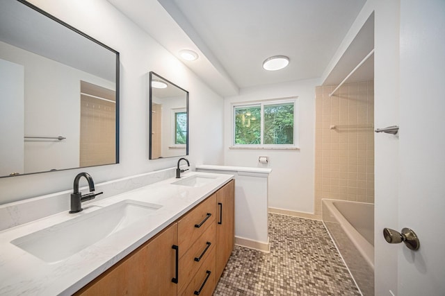 2402 Victoria Ave, Ann Arbor, MI 48104 - full bath featuring double vanity, tile patterned flooring, shower / washtub combination, and baseboards