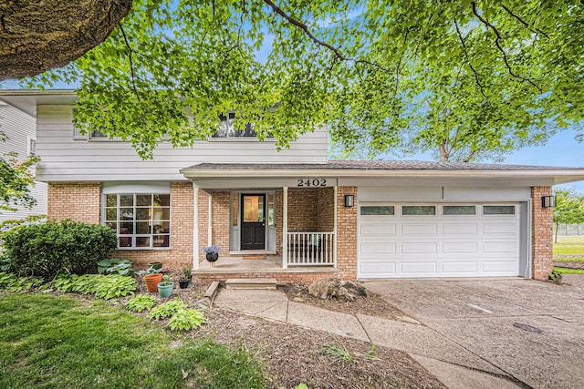 2402 Victoria Ave, Ann Arbor, MI 48104 - traditional-style house featuring brick siding, driveway, and a garage