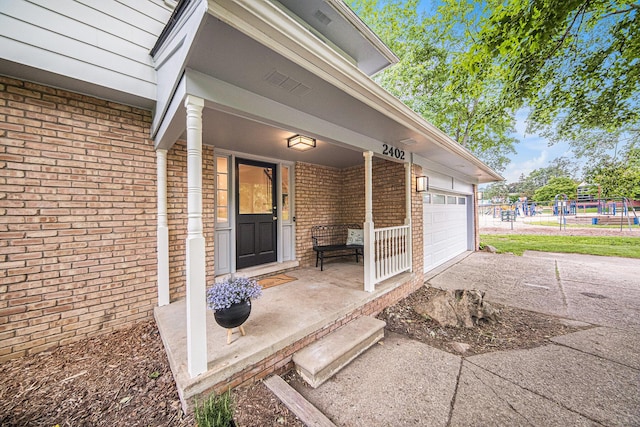 2402 Victoria Ave, Ann Arbor, MI 48104 - entrance to property with brick siding, covered porch, and driveway