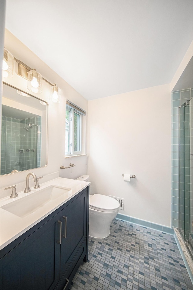 2402 Victoria Ave, Ann Arbor, MI 48104 - full bathroom with vanity, toilet, and tiled shower