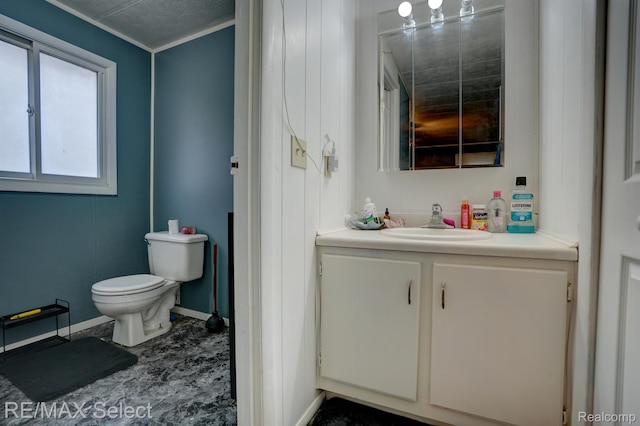 10304 Nichols Rd, Montrose, MI 48457 - half bathroom with vanity, toilet, baseboards, and crown molding