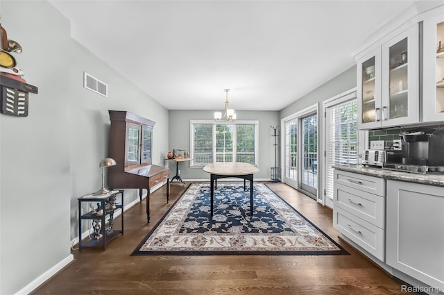 100 Overhill Rd, Bloomfield Hills, MI 48301 - dining space with plenty of natural light, a chandelier, baseboards, and dark wood finished floors
