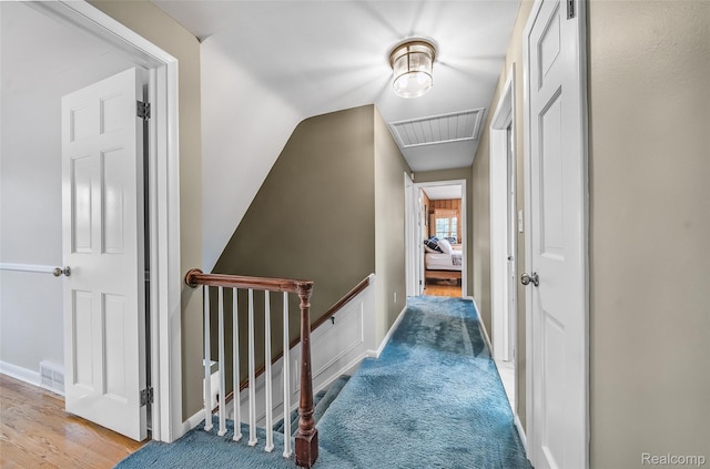 100 Overhill Rd, Bloomfield Hills, MI 48301 - hall with attic access, an upstairs landing, and baseboards