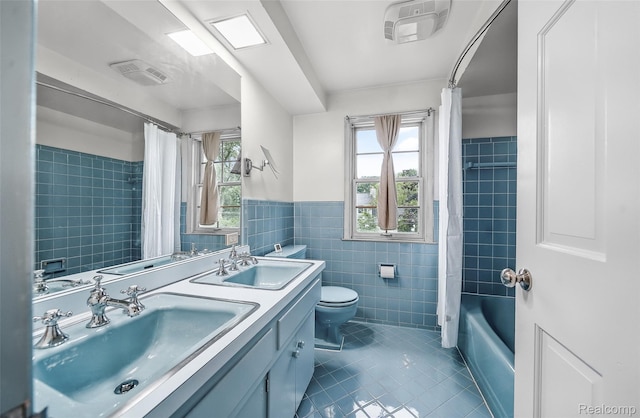 100 Overhill Rd, Bloomfield Hills, MI 48301 - bathroom featuring tile patterned flooring, tile walls, healthy amount of natural light, toilet, and double vanity