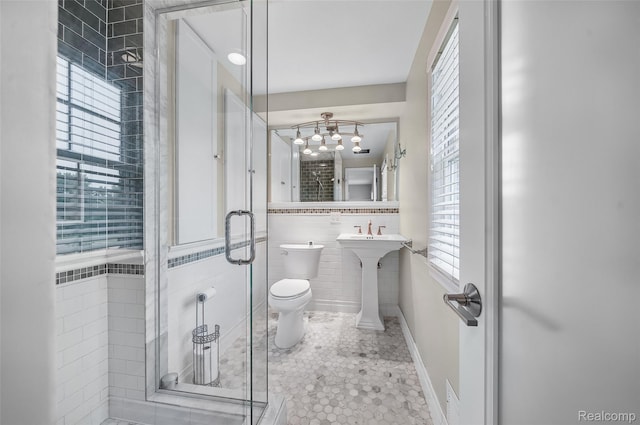 100 Overhill Rd, Bloomfield Hills, MI 48301 - full bath with tile walls, toilet, a shower stall, a chandelier, and a sink