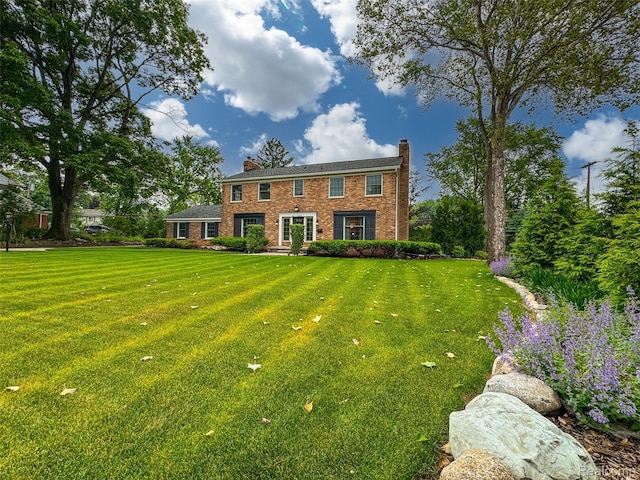 100 Overhill Rd, Bloomfield Hills, MI 48301 - view of front facade featuring a front lawn, brick siding, and a chimney
